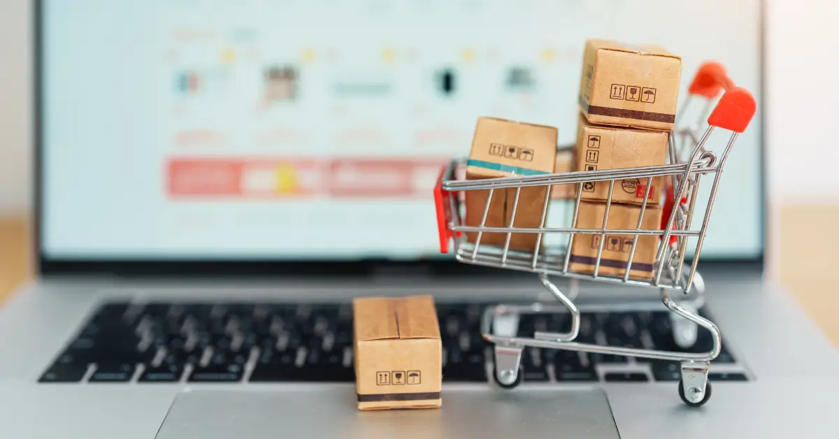 shopping cart with boxes and computer