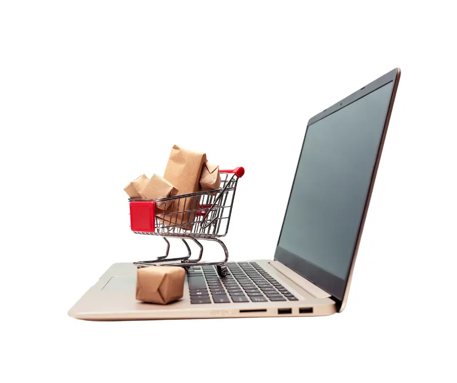 computer and shopping cart with boxes